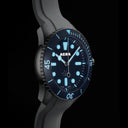 AERA D-1 Ocean blue dial glowing with Swiss Super-LumiNova in low light